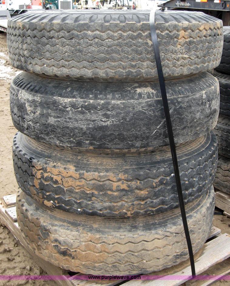 image for item 2554 (8) 10.00-20 rims and tires