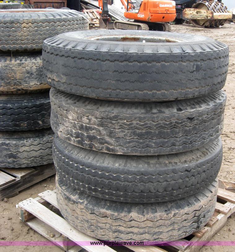 image for item 2554 (8) 10.00-20 rims and tires