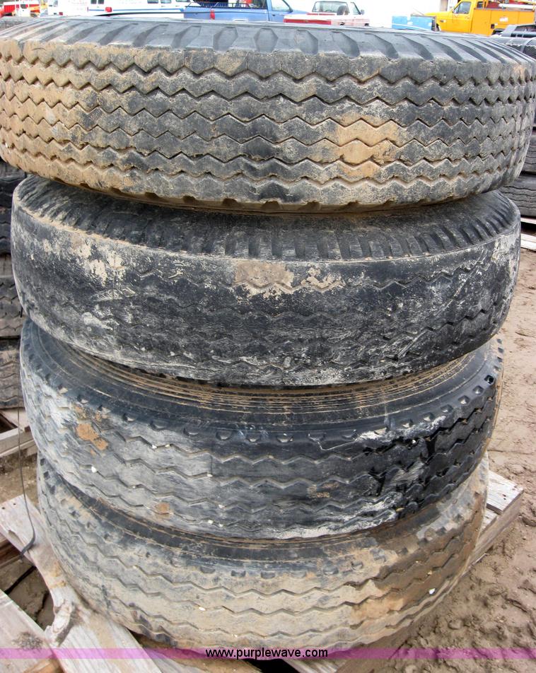 image for item 2554 (8) 10.00-20 rims and tires