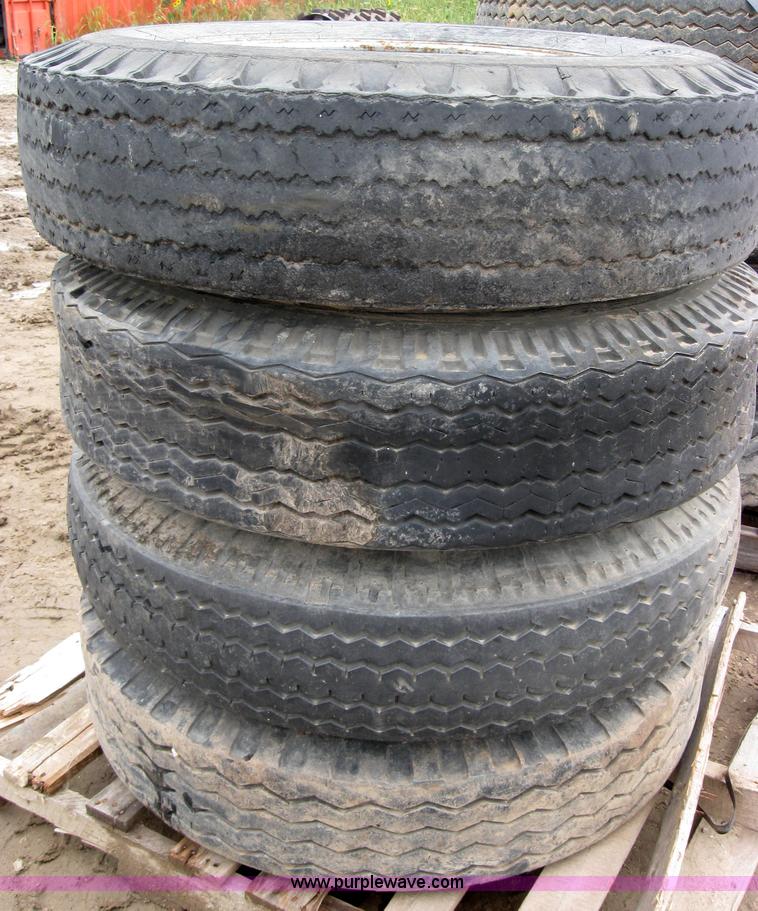 image for item 2554 (8) 10.00-20 rims and tires