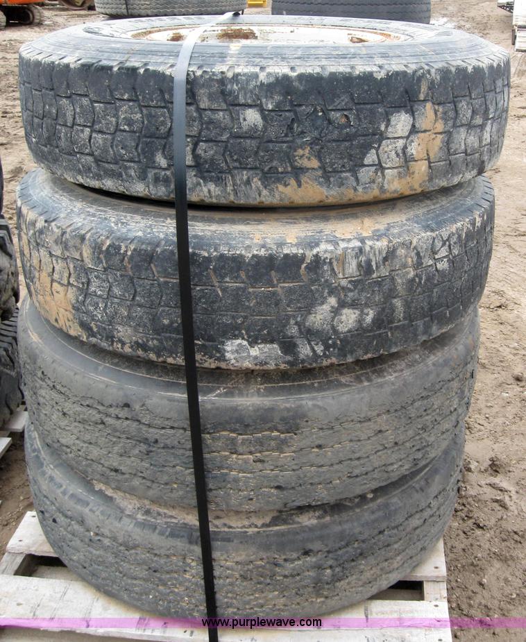image for item 2555 (8) 10.00-20 rims and tires