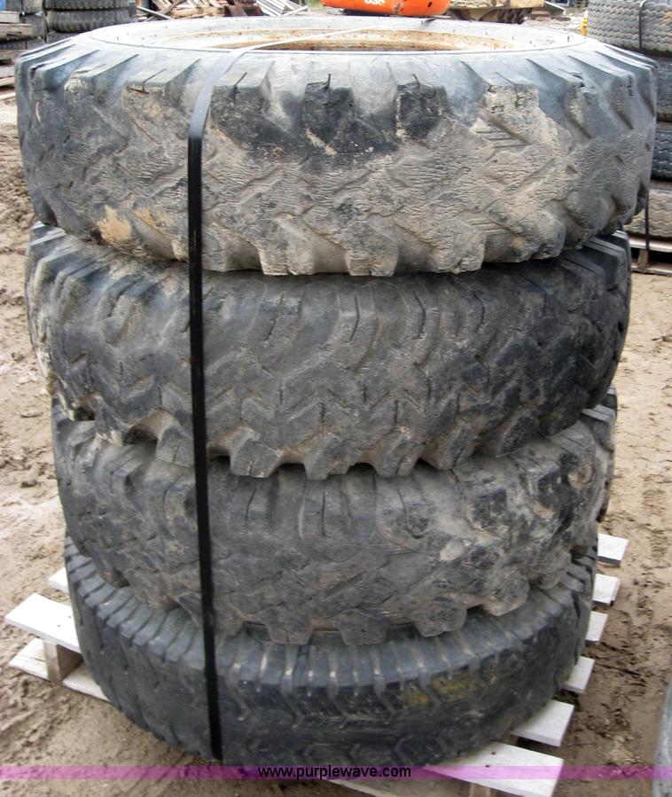 image for item 2555 (8) 10.00-20 rims and tires