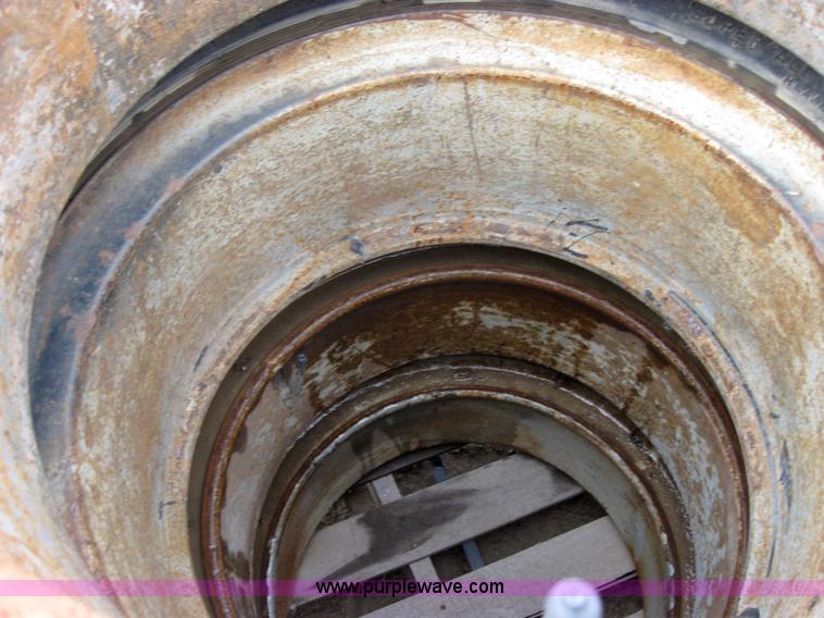 image for item 2555 (8) 10.00-20 rims and tires