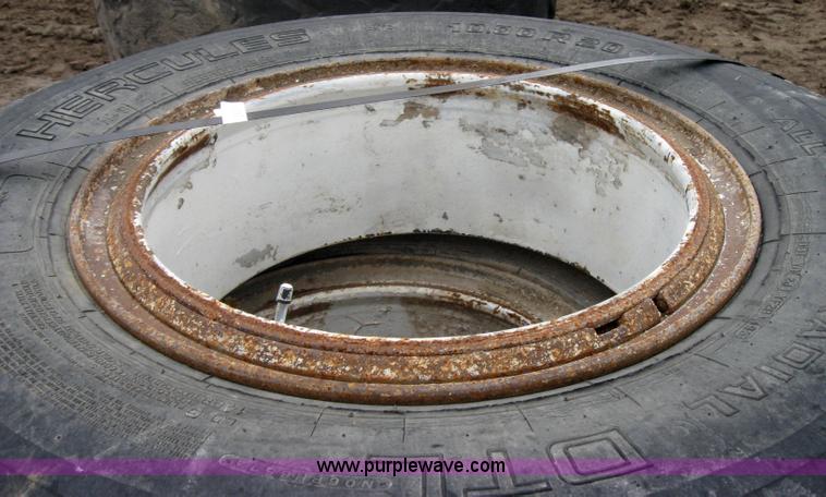 image for item 2555 (8) 10.00-20 rims and tires