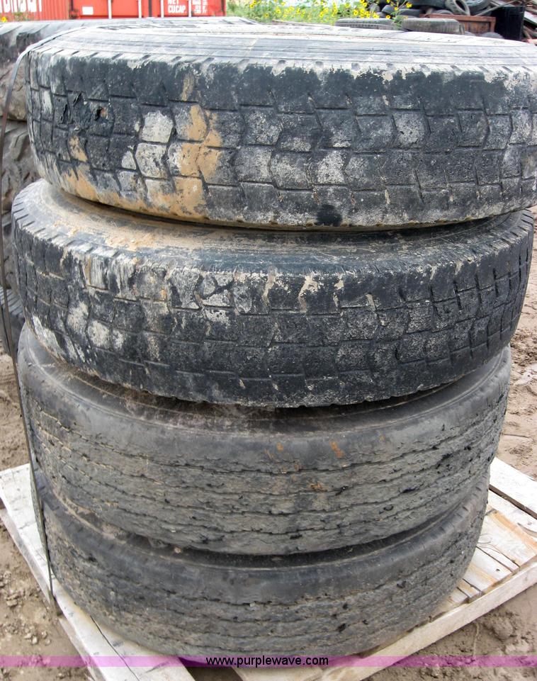 image for item 2555 (8) 10.00-20 rims and tires