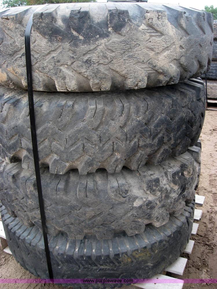image for item 2555 (8) 10.00-20 rims and tires