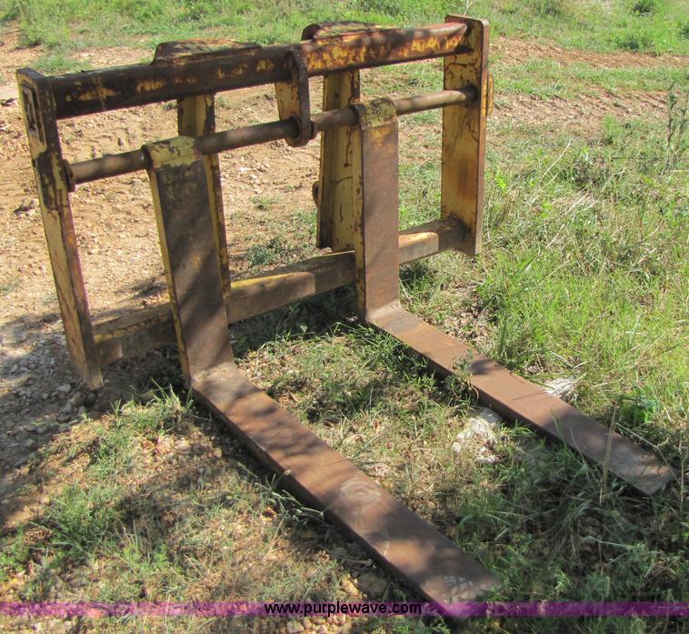 image for item 3128 Balderson quick coupler with bucket and pallet forks