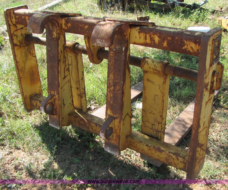 image for item 3128 Balderson quick coupler with bucket and pallet forks