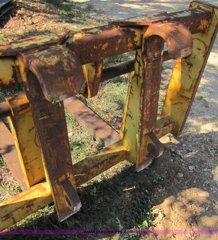 image for item 3128 Balderson quick coupler with bucket and pallet forks