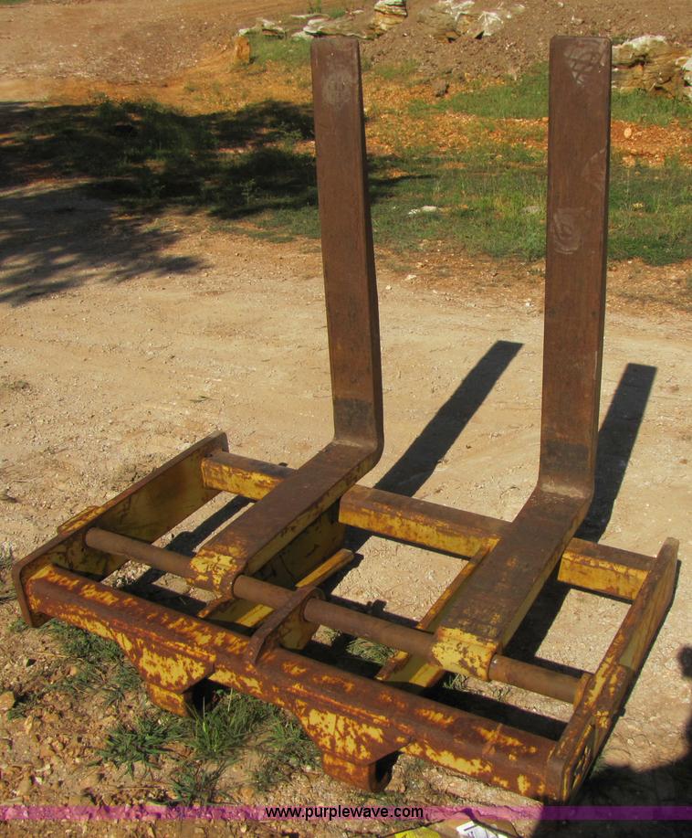 image for item 3128 Balderson quick coupler with bucket and pallet forks