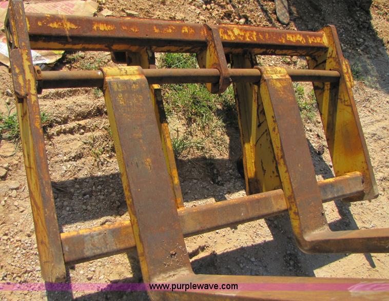 image for item 3128 Balderson quick coupler with bucket and pallet forks