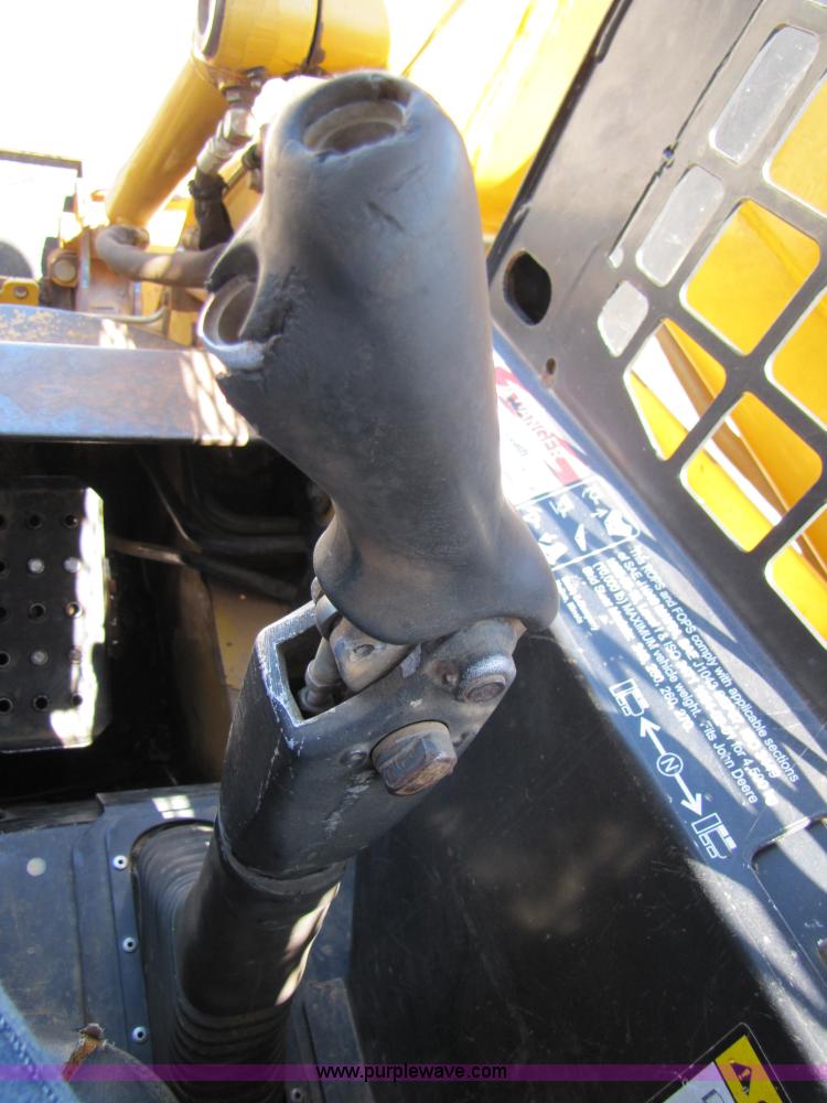 image for item 3136 1999 John Deere 250 skid steer