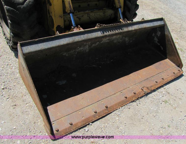 image for item 3136 1999 John Deere 250 skid steer
