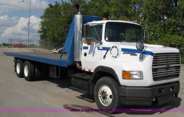 image for item 5104 1994 Ford LTA9000 Aero Max 106 truck with 28' roll back bed