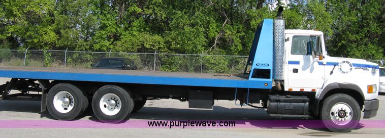 image for item 5104 1994 Ford LTA9000 Aero Max 106 truck with 28' roll back bed