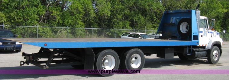 image for item 5104 1994 Ford LTA9000 Aero Max 106 truck with 28' roll back bed