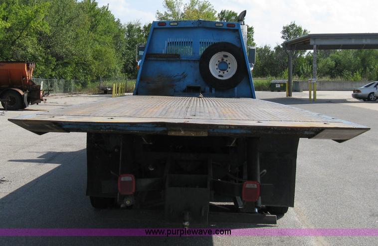 image for item 5104 1994 Ford LTA9000 Aero Max 106 truck with 28' roll back bed