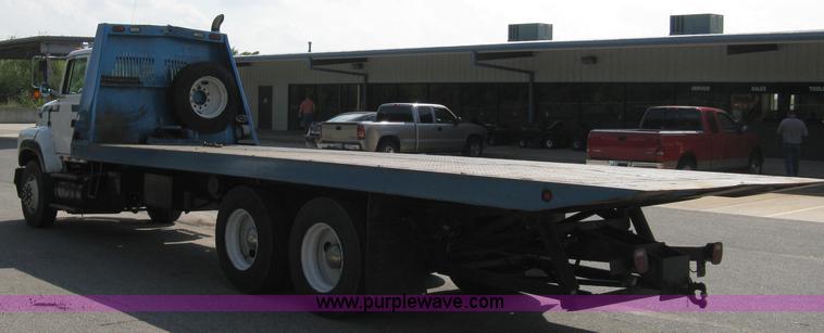 image for item 5104 1994 Ford LTA9000 Aero Max 106 truck with 28' roll back bed