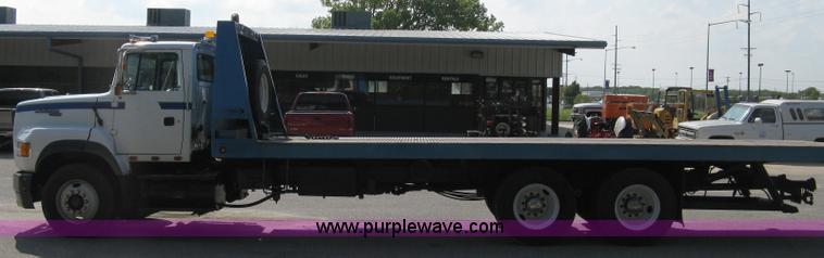 image for item 5104 1994 Ford LTA9000 Aero Max 106 truck with 28' roll back bed