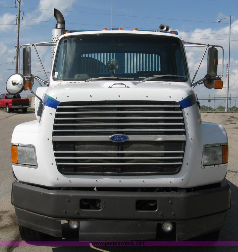 image for item 5104 1994 Ford LTA9000 Aero Max 106 truck with 28' roll back bed