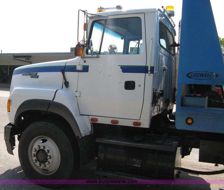 image for item 5104 1994 Ford LTA9000 Aero Max 106 truck with 28' roll back bed