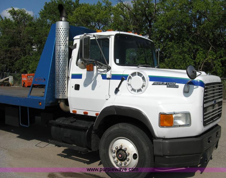 image for item 5104 1994 Ford LTA9000 Aero Max 106 truck with 28' roll back bed