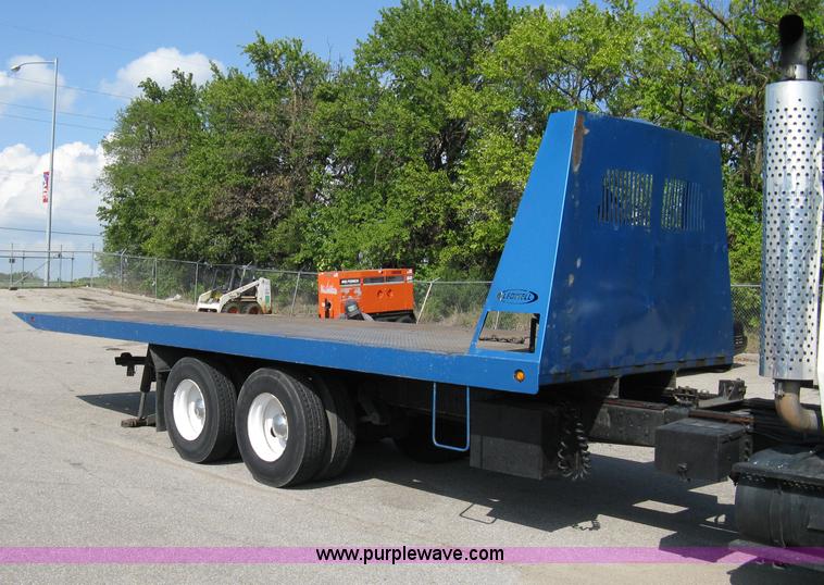 image for item 5104 1994 Ford LTA9000 Aero Max 106 truck with 28' roll back bed