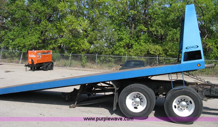 image for item 5104 1994 Ford LTA9000 Aero Max 106 truck with 28' roll back bed
