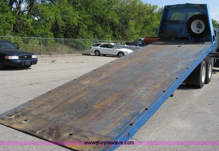 image for item 5104 1994 Ford LTA9000 Aero Max 106 truck with 28' roll back bed