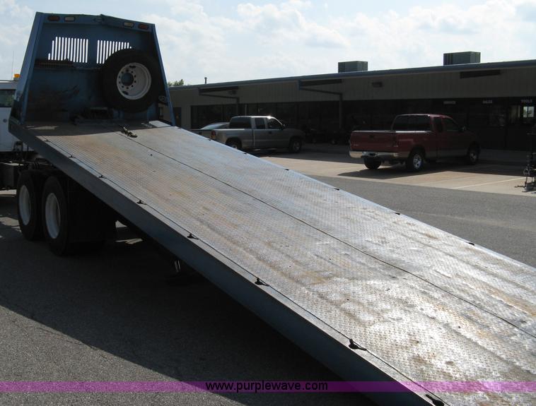 image for item 5104 1994 Ford LTA9000 Aero Max 106 truck with 28' roll back bed