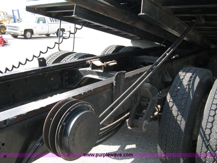 image for item 5104 1994 Ford LTA9000 Aero Max 106 truck with 28' roll back bed