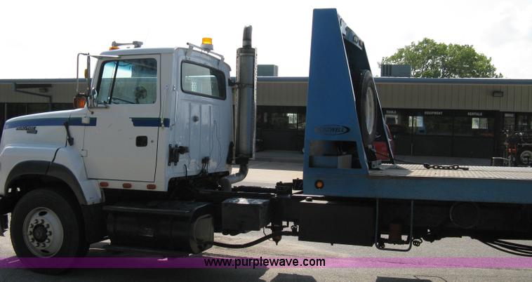 image for item 5104 1994 Ford LTA9000 Aero Max 106 truck with 28' roll back bed