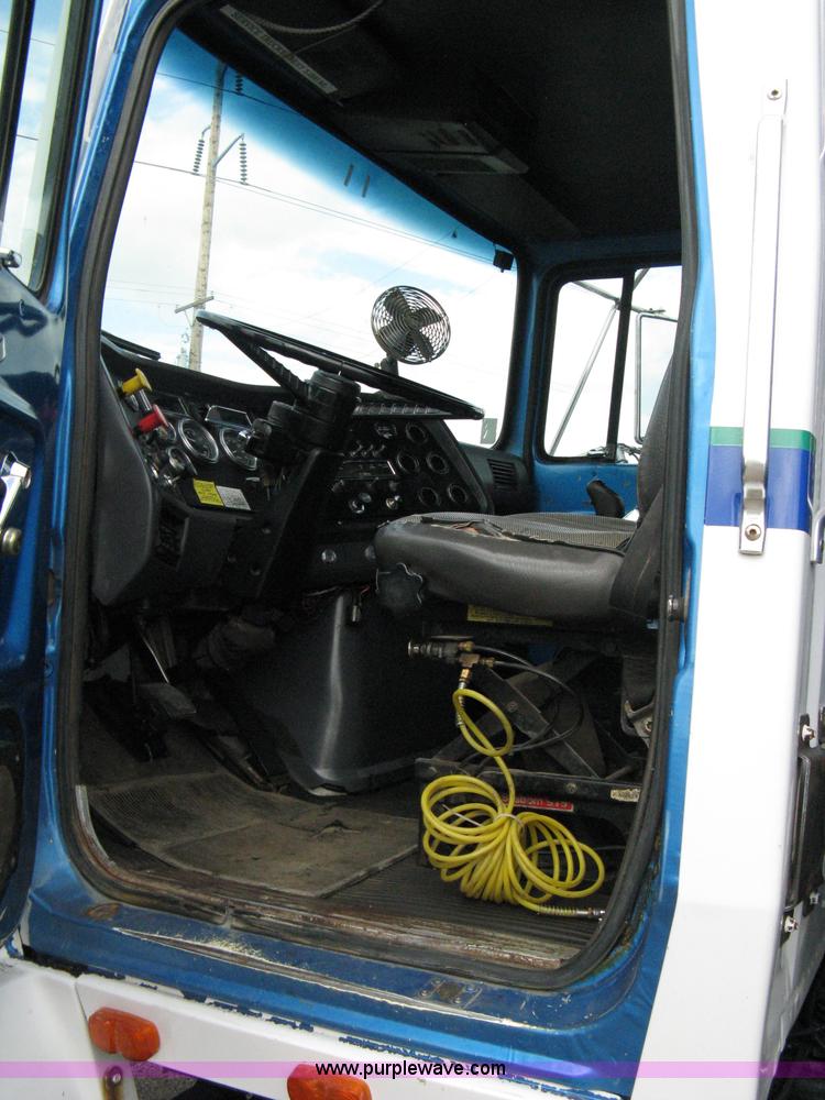 image for item 5104 1994 Ford LTA9000 Aero Max 106 truck with 28' roll back bed