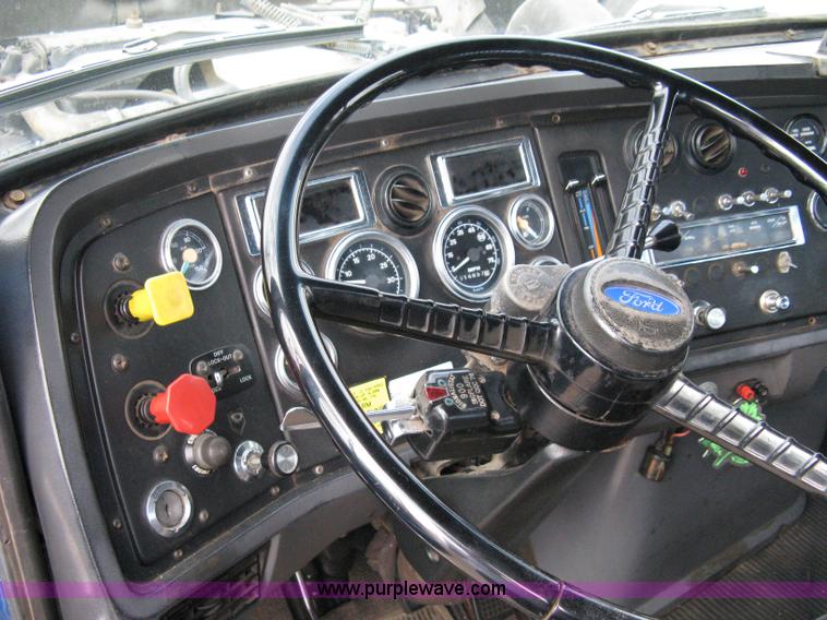 image for item 5104 1994 Ford LTA9000 Aero Max 106 truck with 28' roll back bed