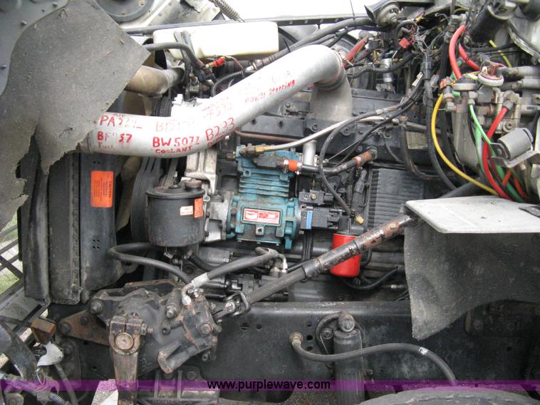 image for item 5104 1994 Ford LTA9000 Aero Max 106 truck with 28' roll back bed