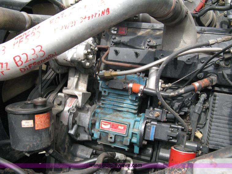 image for item 5104 1994 Ford LTA9000 Aero Max 106 truck with 28' roll back bed