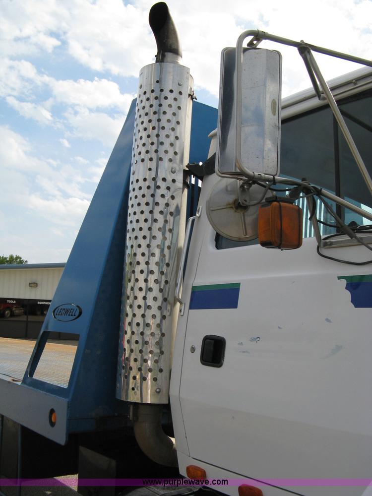 image for item 5104 1994 Ford LTA9000 Aero Max 106 truck with 28' roll back bed