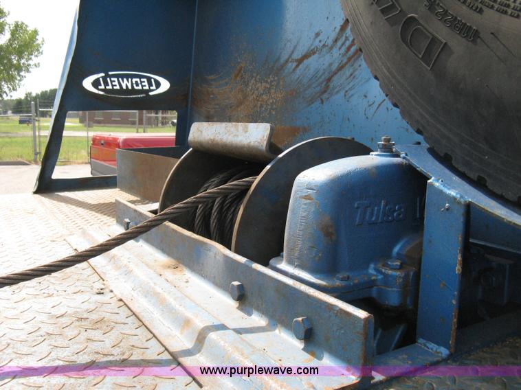 image for item 5104 1994 Ford LTA9000 Aero Max 106 truck with 28' roll back bed