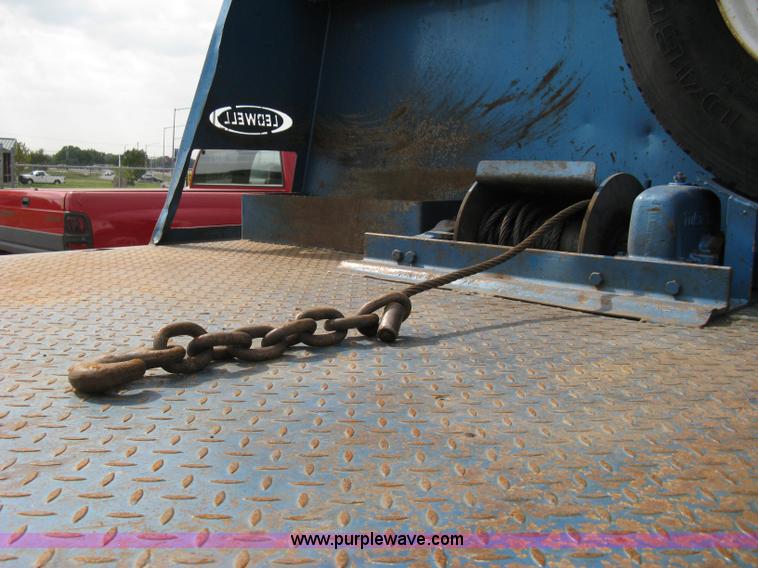 image for item 5104 1994 Ford LTA9000 Aero Max 106 truck with 28' roll back bed