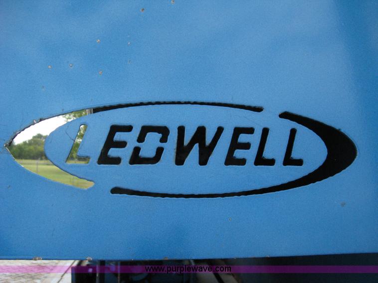 image for item 5104 1994 Ford LTA9000 Aero Max 106 truck with 28' roll back bed