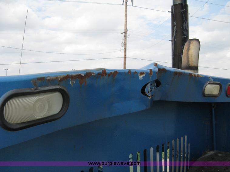 image for item 5104 1994 Ford LTA9000 Aero Max 106 truck with 28' roll back bed