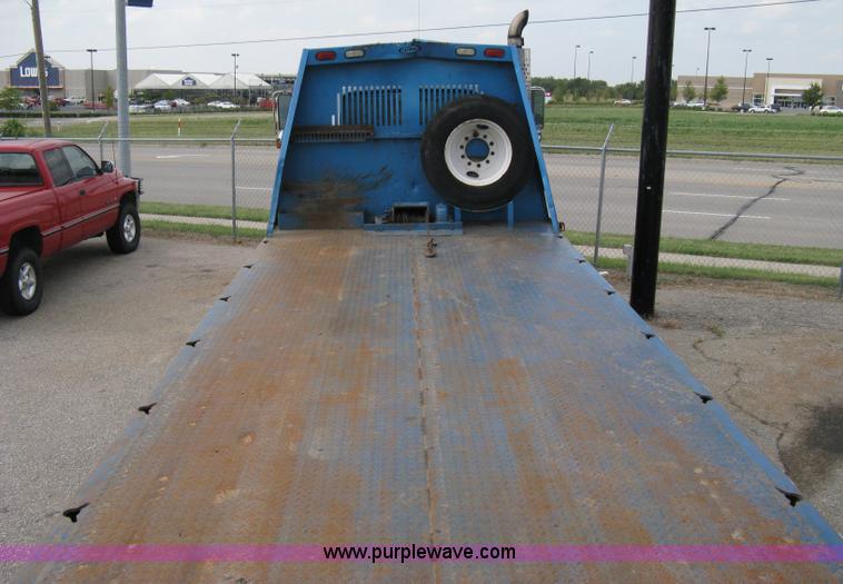 image for item 5104 1994 Ford LTA9000 Aero Max 106 truck with 28' roll back bed