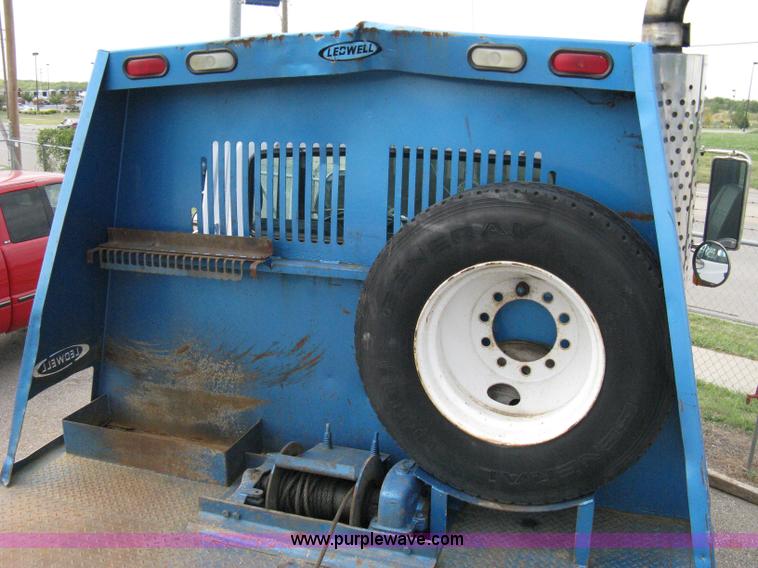 image for item 5104 1994 Ford LTA9000 Aero Max 106 truck with 28' roll back bed