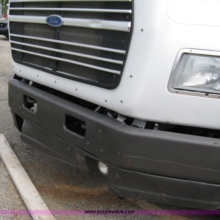 image for item 5104 1994 Ford LTA9000 Aero Max 106 truck with 28' roll back bed