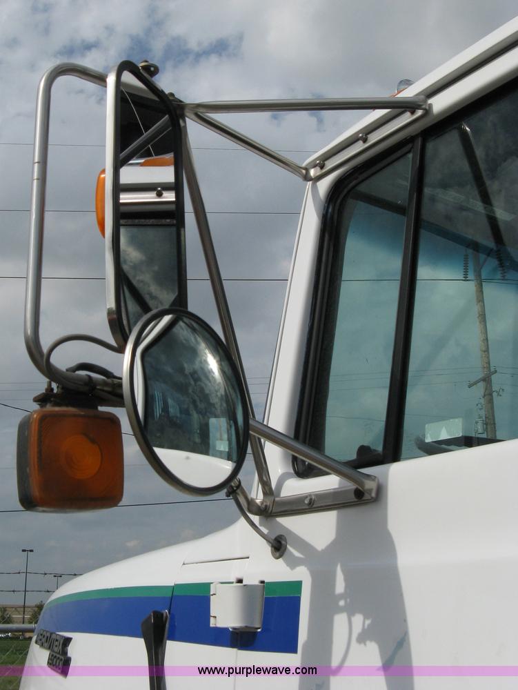 image for item 5104 1994 Ford LTA9000 Aero Max 106 truck with 28' roll back bed