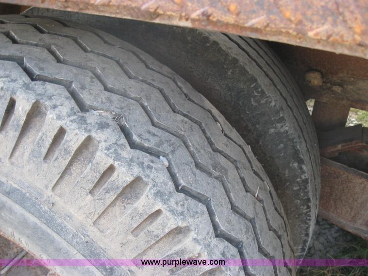 image for item 5566 1981 Bush Hog Landcraft 32' flatbed trailer