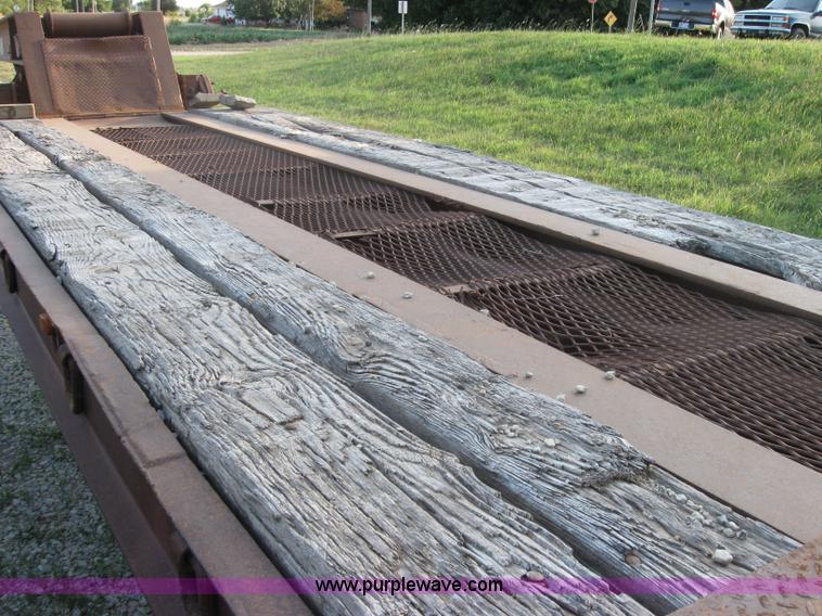 image for item 5566 1981 Bush Hog Landcraft 32' flatbed trailer