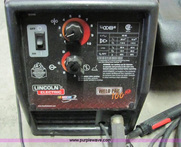 image for item 2251 Lincoln 110 mig welder with helmet