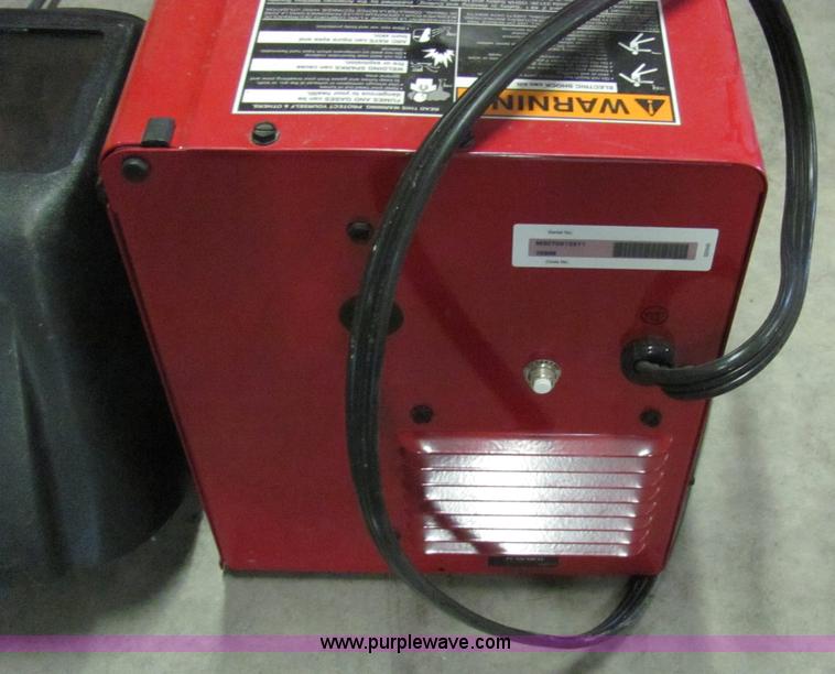 image for item 2251 Lincoln 110 mig welder with helmet