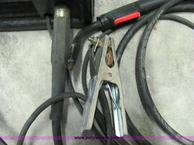 image for item 2251 Lincoln 110 mig welder with helmet